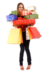 Attractive woman holding many gift boxes and bags