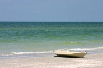 Boat on the sea shore on Florida's Gulf Coast.