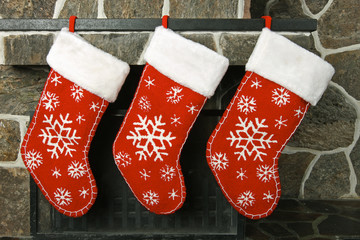 Christmas stockings on a fireplace mantel - 10006279