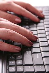 Close-up of a hands typing on keyboard