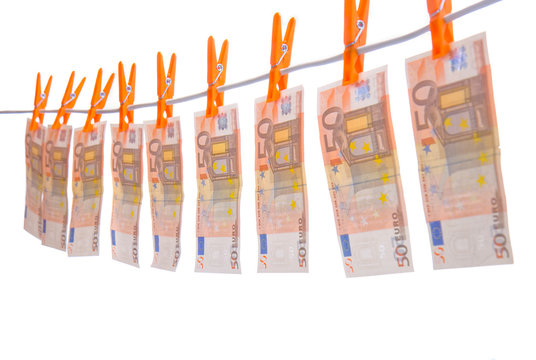 Money hanging on line. 5o euro  bills. focus is on middle bills