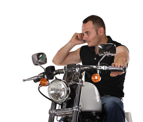 Fototapeta na wymiar man with short hair talking on the phone and riding a bike,