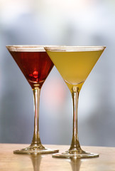 A margerita and cosmopolitan Cocktail drink on a bar top.