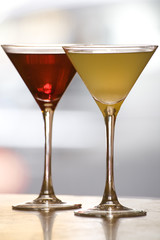 A margerita and cosmopolitan Cocktail drink on a bar top.