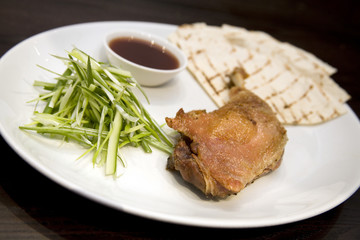 Crispy duck leg with spring onions and plum sauce