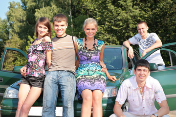 Group of friends with car outdoor