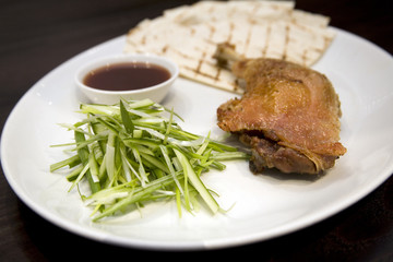 Crispy duck leg with spring onions and plum sauce
