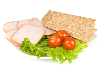 The sausage cut by slices on a dish