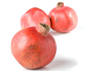 Fresh appetizing pomegranate on a white background