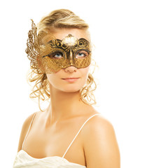 Beautiful blond woman in a golden carnival mask