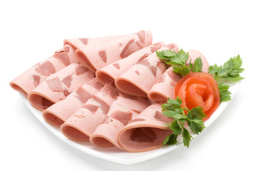 The sausage cut by slices on a dish