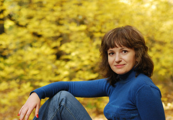 The girl on a background autumn forest