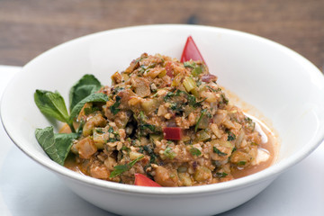 A bowl of fried Aubergine and pepper stew