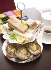 An arrangement of sandwiches and scones for afternoon tea
