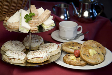 An arrangement of sandwiches and scones for afternoon tea