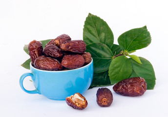 Blue cap full of dried dates