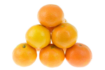 Pyramid of tangerines on white.