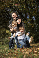 Fototapeta premium happy family in autumn nature