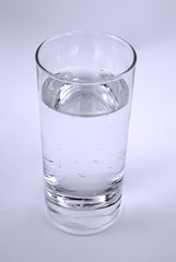 One glass with fresh soda water .