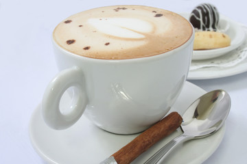 Coffee cappuccino with cinnamon stick