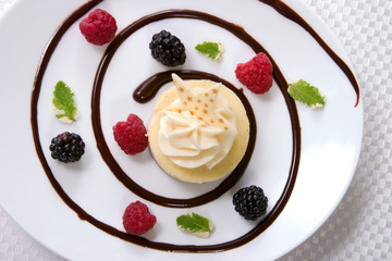 Delicious Vanilla Bean Cheesecake with fresh raspberries