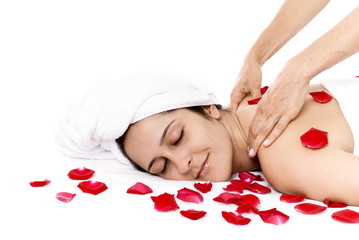 Obraz na płótnie Canvas Woman receiving massage in beauty treatment center