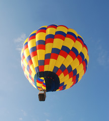 Brightly colored hot air balloon in early morning