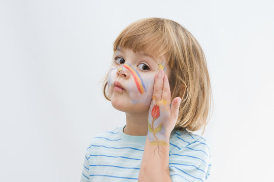 lovely, happy little  girl with painted face