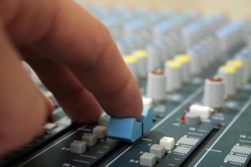 hand of sound engineer on the sound mixer © Photo_Ma