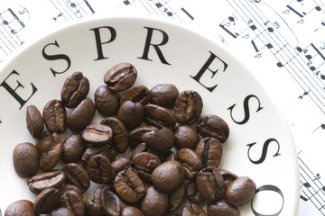 coffee beans, expresso saucer and music score