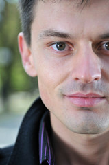 Handsome young man looking in nature