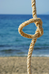 rope with a knot - sea background