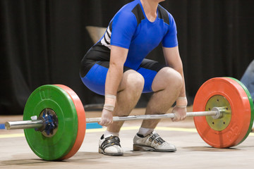 A weightlifter about to lift