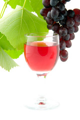 Glass and grapes on a white background
