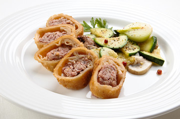 Stuffed fried pancakes with meat and vegetable salad