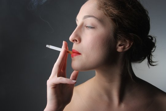beautiful woman smoking a cigarette