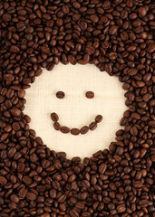 smiley face shape in coffee beans background