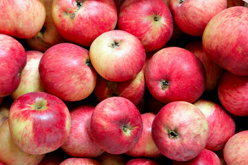 Heap of red ripe apples, may be used as background