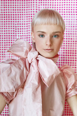 Young attractive woman wearing a pink dress