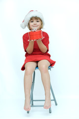Christmas kid in Santa hat on white background