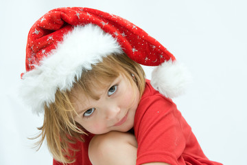Christmas kid in Santa hat on white background