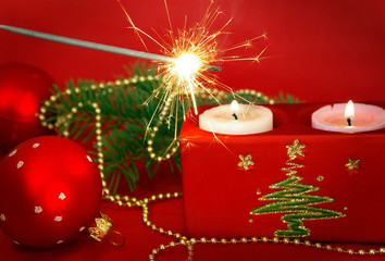 Christmas card. Candles and sparkler isolated on red