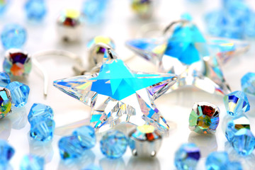 Transparent star shape earrings put together with beads.