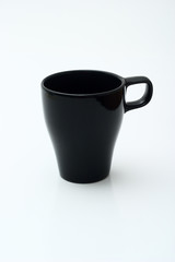 Black mug of modern design on a white background