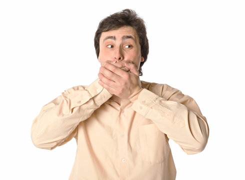 Man covering his mouth with hands, white background
