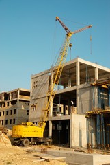 Fototapeta na wymiar Building crane and construction.