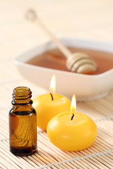 Fototapeta na wymiar honey essential oil and fresh honey - beauty treatment