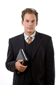 Handsome businessman holding notebook, white background.