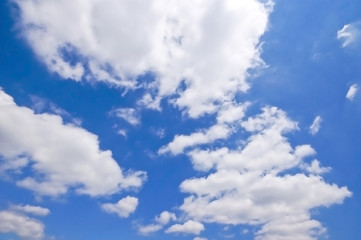 Naklejka na ściany i meble a lot of white clouds on a blue sky