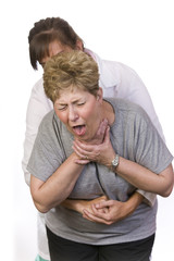 Using the Heimlich Maneuver on a choking person